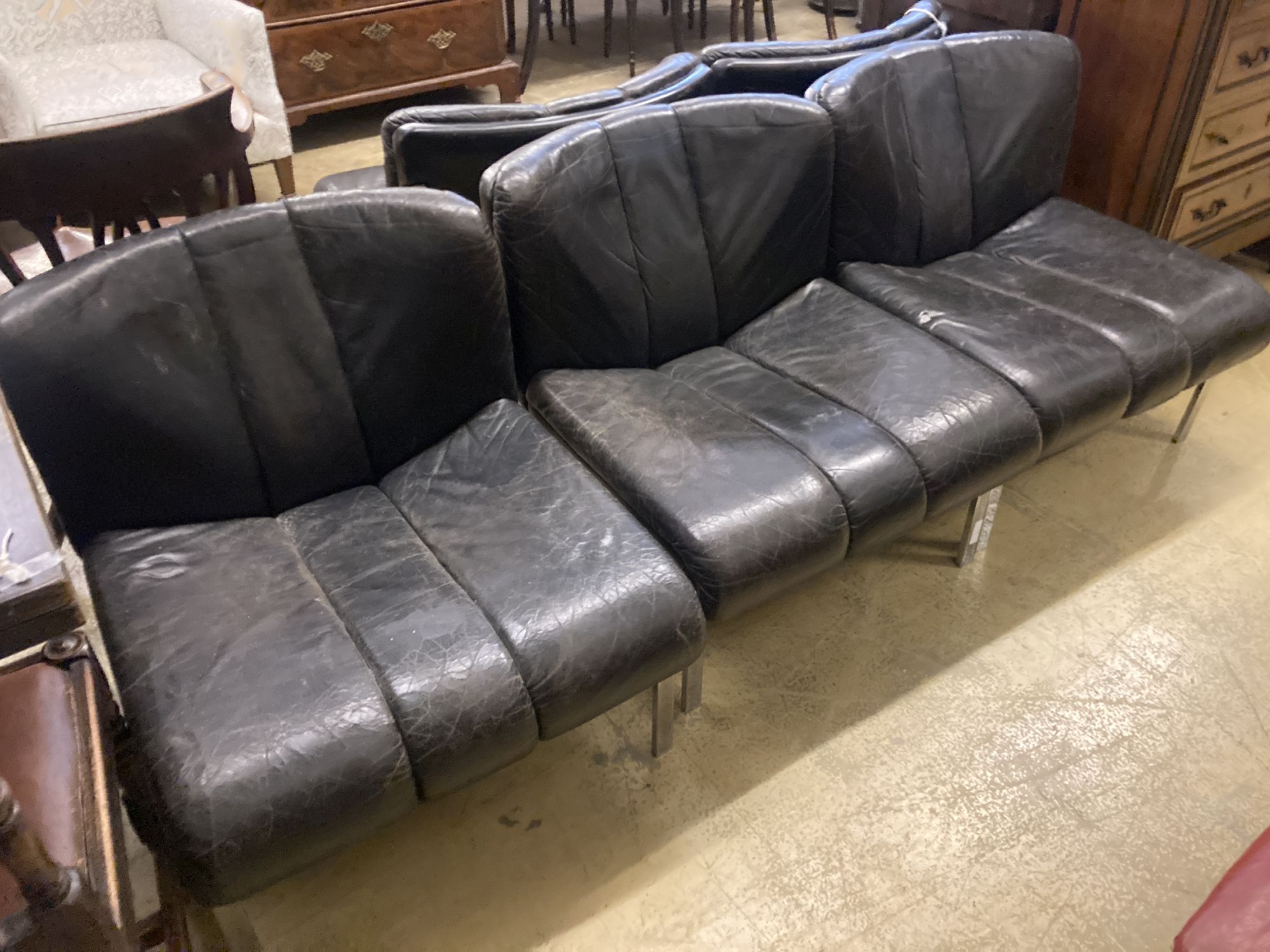 A set of five mid century black leather and chrome banquette chairs, width 65cm, depth 70cm, height 68cm
